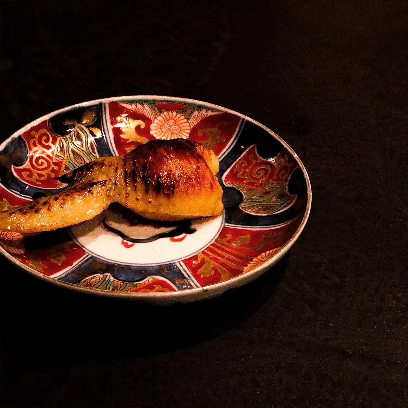 『薪焼きの手羽とリゾット米』